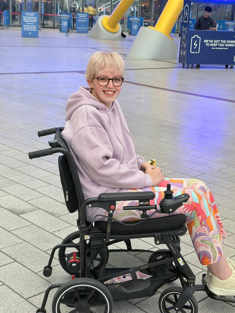 Leah in her Navigator powerchair at the O2.