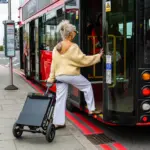 lady getting on bus